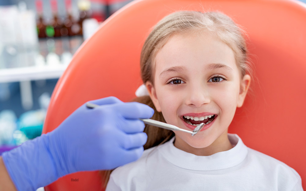 Kid at dental office for regular dental checkup