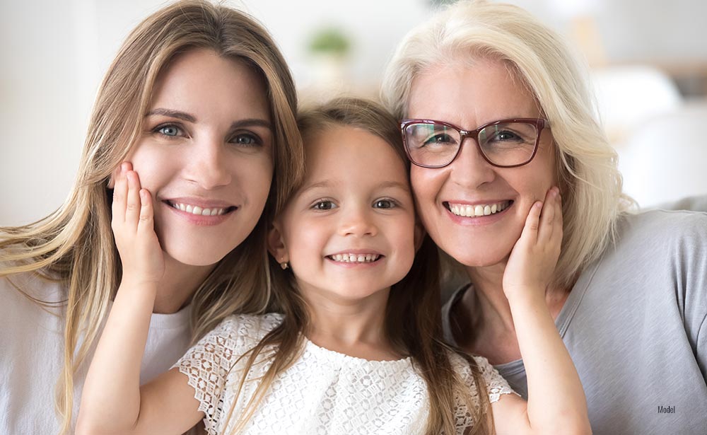 Portrait of three generations of women look